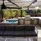 Hot tub with pergola outdoor kitchen paver patio fireplace hot tub lowry co